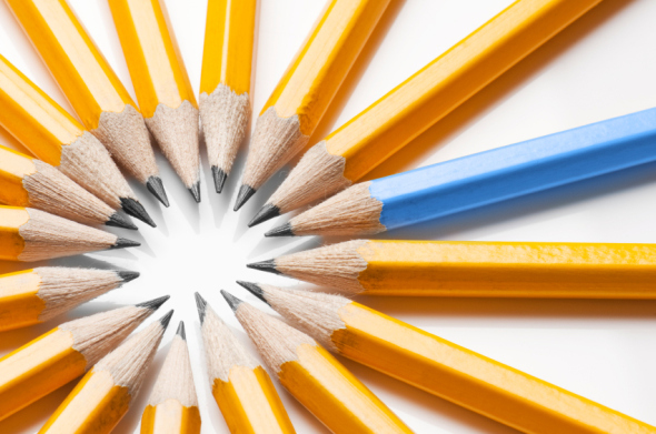 Blue pencil among yellow pencils