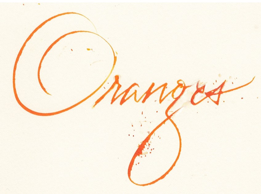 Handwritmic tool and watercolour to letter the word "orange".