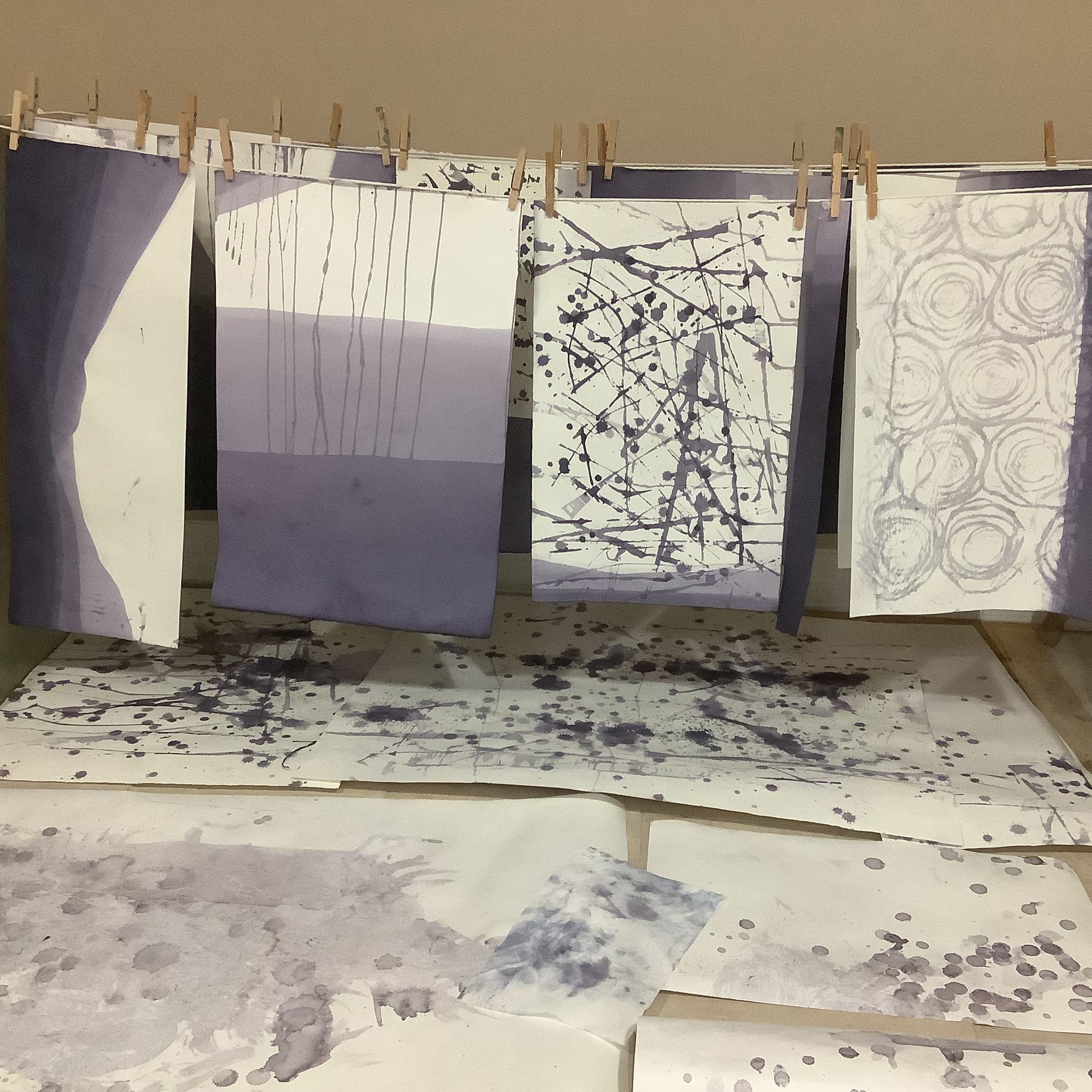 Dyed sheets hanging on a laundry line