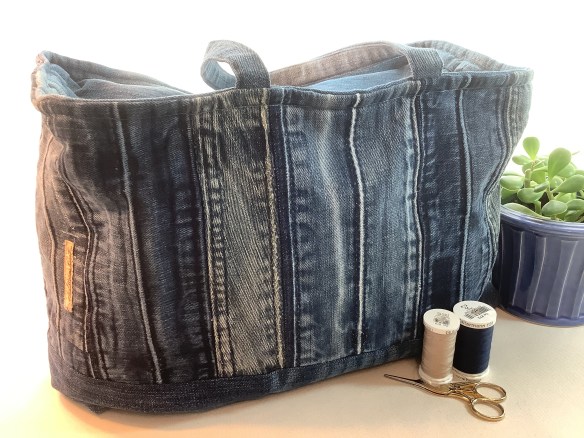 Denim waistbands sewn vertically in a travel bag